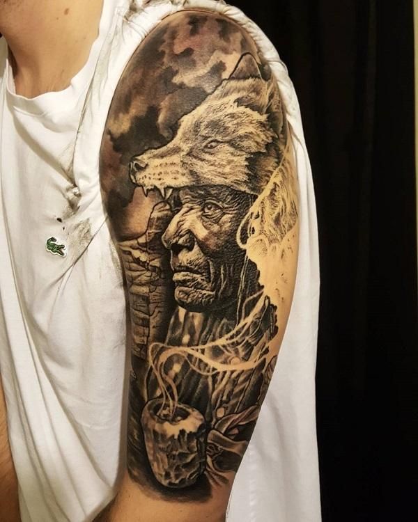 a man with a wolf tattoo on his arm