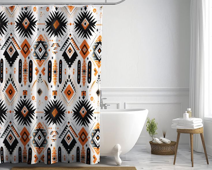 an orange and black shower curtain in a bathroom with a bathtub next to it