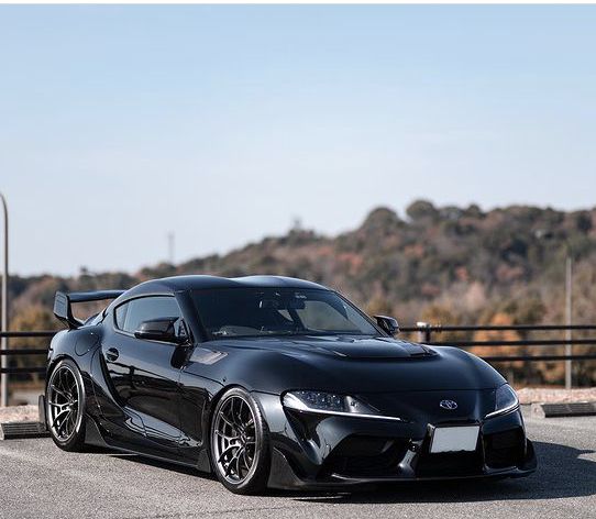 a black sports car parked on the street