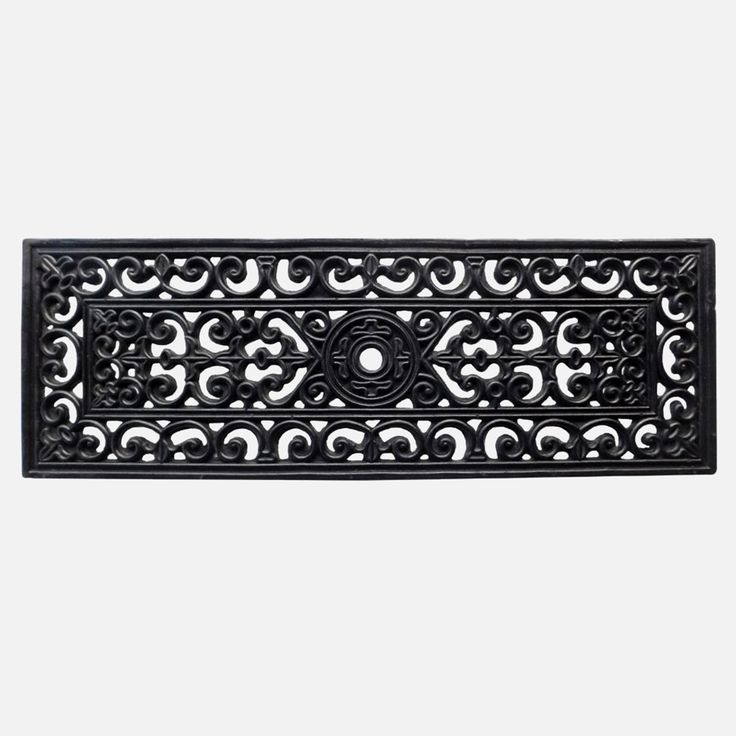 an ornate design is shown on the side of a door mat that has been painted black