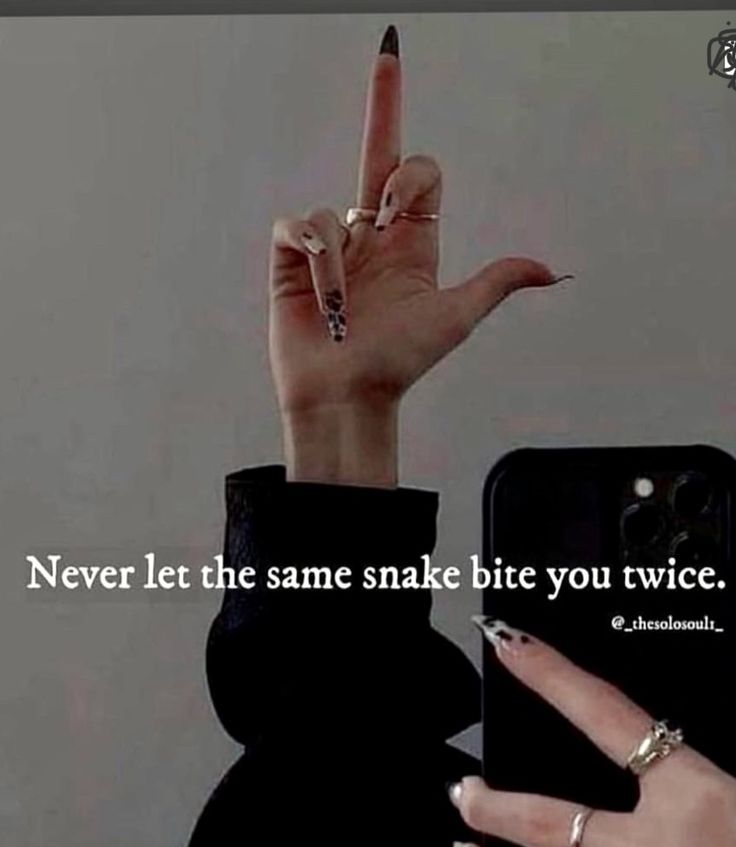 someone holding up their cell phone with the words never let the same snake bite you twice