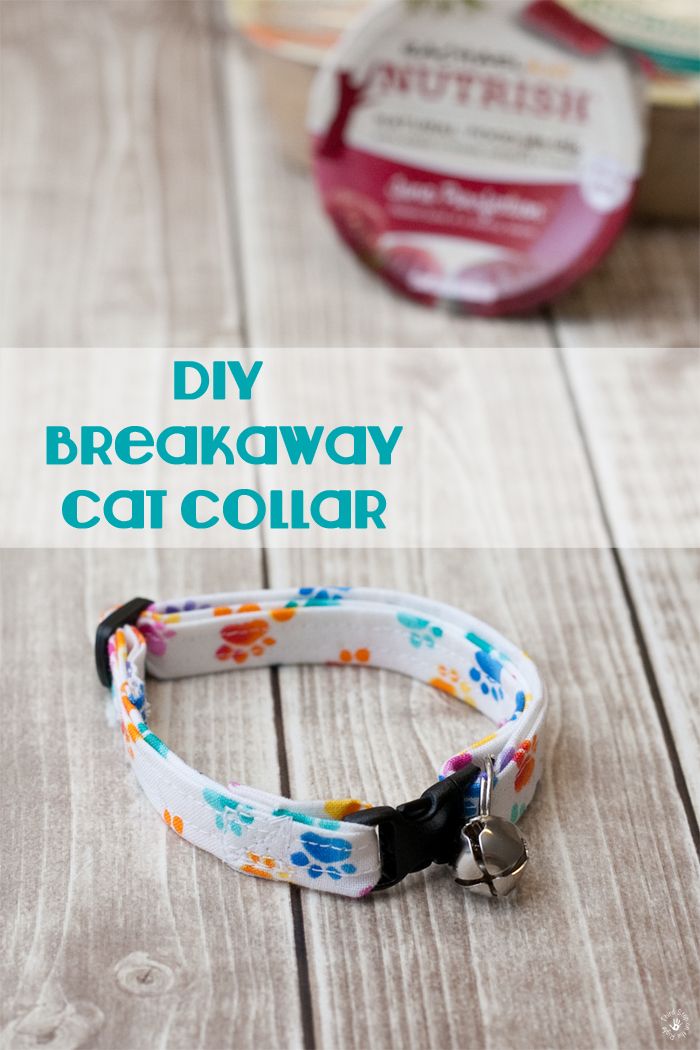 the diy breakaway cat collar is made from an upcycled fabric and has paw prints on it