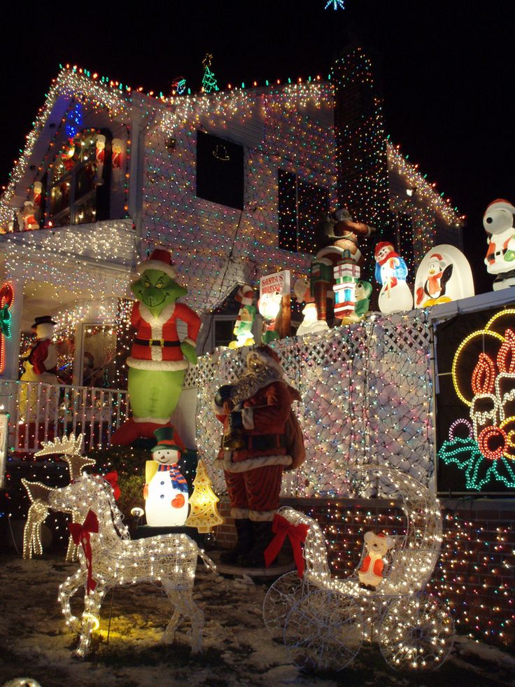 a house covered in christmas lights and decorations