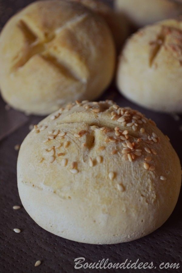 bread rolls with crumbs are on a table