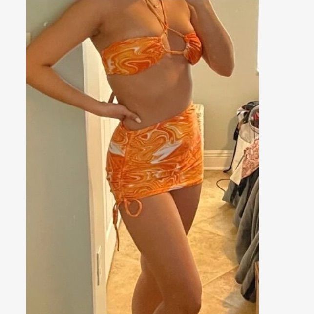 Orange White Abstract Fluid Pattern Halter Bikini Swimsuit 3 Piece New Without Tags Size Small Includes Top, Bottoms, And Skirt!! Top Can Be Worn Several Ways **Brand Is Not Princess Polly, Tagged For Exposure No Returns Orange Beachy Swimwear With Tropical Print, Orange Tropical Swimwear, Orange Tropical Print Beachy Swimwear, Orange Floral Print Beachy Swimwear, Orange Beachy Swimwear With Tie-side Bottom, Flower Swimsuit, Swim Suit Bottoms, String Bikinis, Pink Ladies