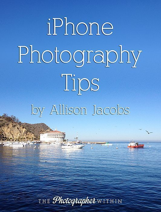 the cover of an iphone photography tips book, with boats in the water and blue sky