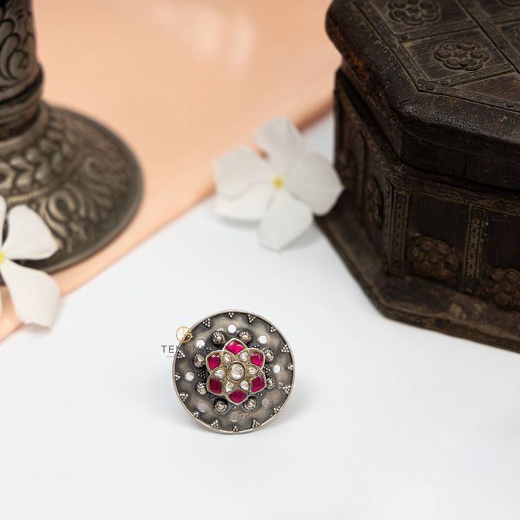 This ring is made in 925 Sterling silver with pink and white kemp stone. This is an adjustable ring will looks good with all casual and occasional outfits. Pair it with any floral outfit and add a dash of exuberance to your look. This piece has been delicately handcrafted by skilled craftsmen who are carrying forward and sharing the Traditional Mughal art of Jewelry making with the entire world. Gross Weight: 13.00 gms Packaging and Shipping Your item is packed very carefully to avoid any in-tra Traditional Silver Ruby Ring For Anniversary, Traditional Gemstone Rings, Silver Ceremonial Toe Ring, Sterling Silver Temple Jewelry Toe Ring, Sterling Silver Temple Toe Ring Jewelry, Sterling Silver Temple Toe Ring, Fusion Style Rings With Intricate Design As Gift, Temple Jewelry Gemstone Rings As Gifts, Traditional Sterling Silver Ruby Ring Gift