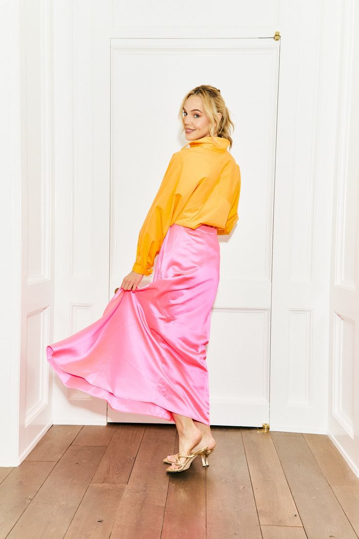 The perfect hue of neon pink that will make any outfit stand out. This pink silk skirt with side zip is a stunner in every way. MADE IN THE USA DRY CLEAN ONLY Pink Silk Evening Skirt, Feminine Pink Maxi Skirt For Party, Feminine Pink Skirt For Night Out, Chic Pink Lined Maxi Skirt, Spring Pink Silk Maxi Skirt, Vibrant Pink Skirt For Spring, Pink Silk Maxi Skirt For Spring, Pink Silk Midi Skirt, Pink Feminine Evening Skirt