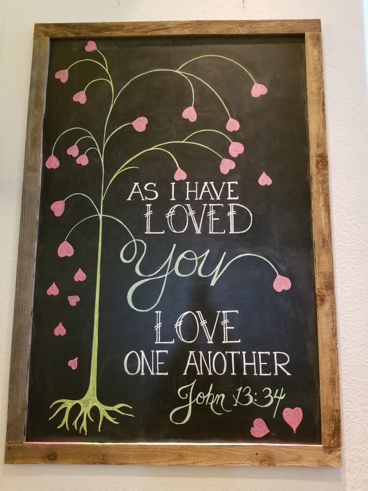 a chalkboard with the words as i have loved you love one another