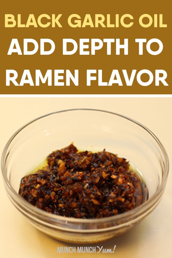 black garlic oil that's perfect for ramen is in a glass bowl on a table