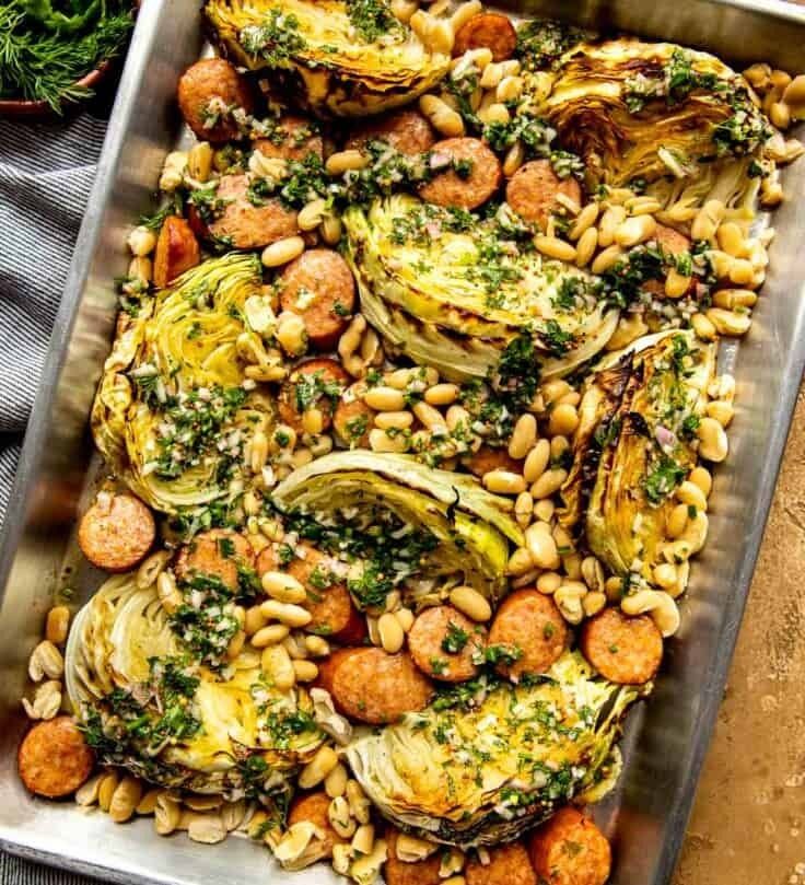 a pan filled with vegetables and beans on top of a table