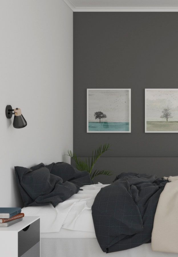 a bedroom with grey walls and white bedding, two pictures on the wall above the bed