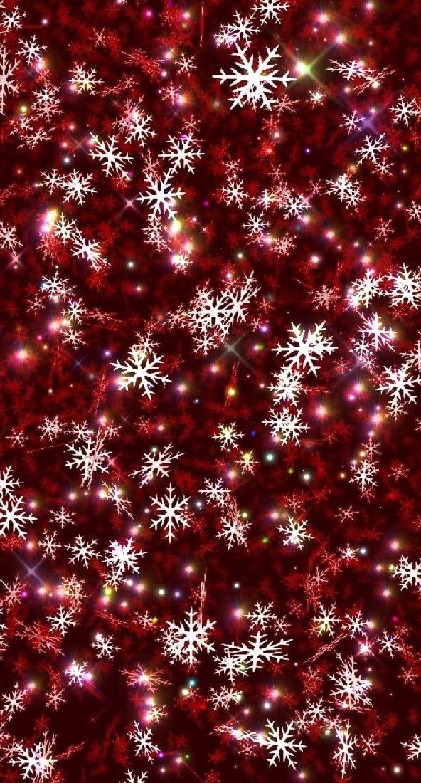 red and white snowflakes are all over the ground with sparkles on them