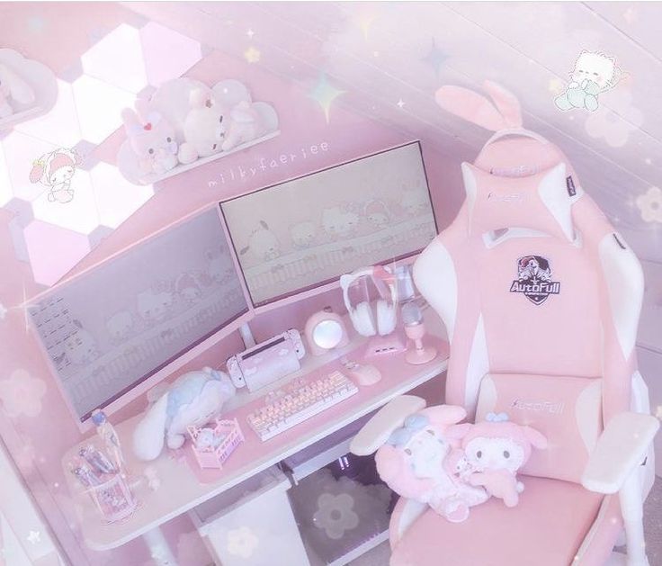 a desk with a chair, computer and stuffed animals on it in a pink room