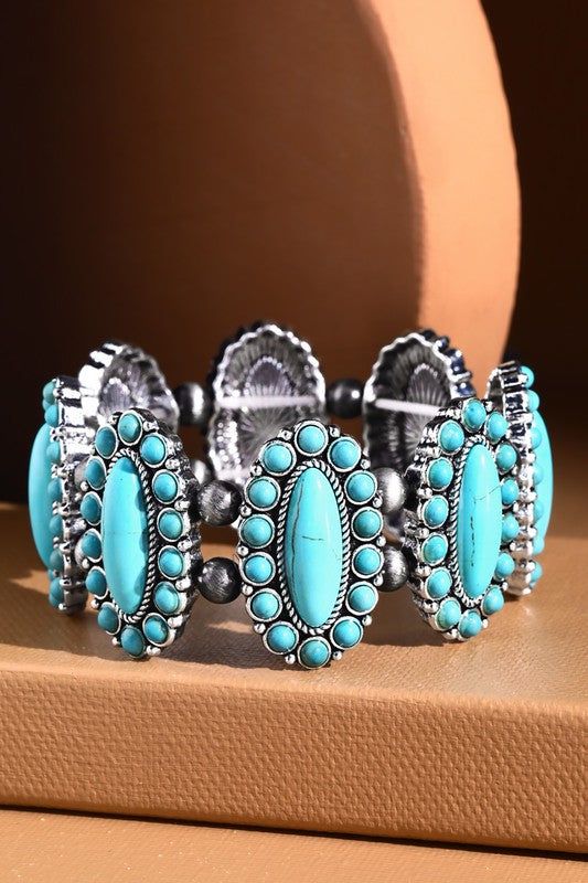 This Navajo Western Natural Stone Stretch Bracelet is a fashionable accessory for everyone's jewelry box! It features beautiful stones in a modern style bracelet design to add some serious bling to your evening wardrobe. Come on, rock this bracelet! *APPROX. L 8.25" Diameter 2.5" Turquoise Bracelet Jewelry, Turquoise Bracelet Fashion Accessory, Turquoise Fashion Bracelet, Elegant Turquoise Bracelets, Bohemian Turquoise Bracelets, Trendy Turquoise Bangle Jewelry, Bohemian Stretch Bracelet With Natural Stones, Adjustable Crystal Bracelet For Festival, Bohemian Metal Bracelets With Stones