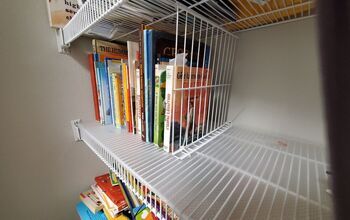 a white shelf filled with lots of books