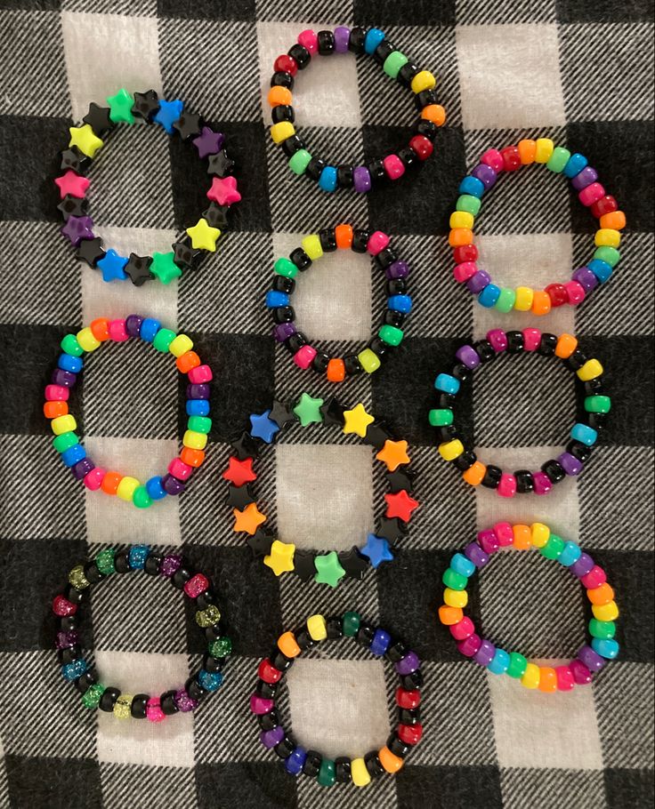 colorful beads spelling out the word love on a checkered tablecloth