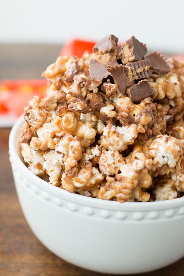 a white bowl filled with cereal and chocolate