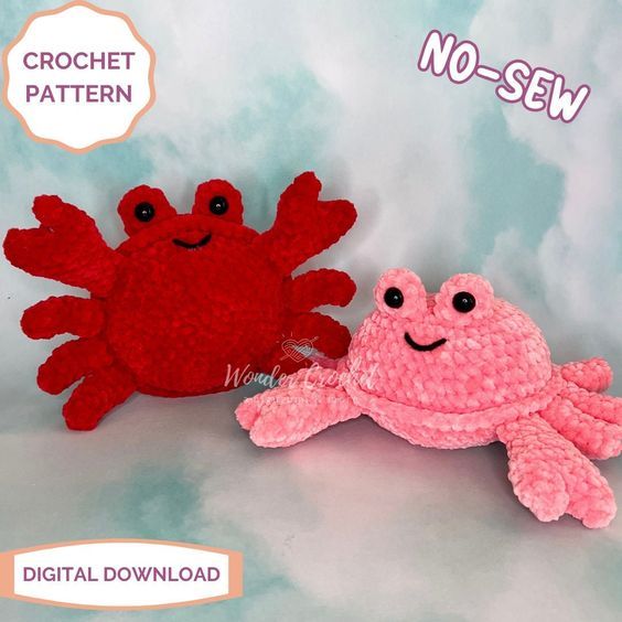 two crocheted crabs sitting next to each other on a blue and white background