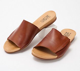 Set the stage for a summer-savvy wardrobe with the Aurelia leather slide. The easy slip-on minimalist design means it won't steal the show from your favorite fashion statements, but is sure to blend beautifully with anything in your closet from casual to dress-to-impress. From Miz Mooz. Summer Leather Open Toe Slip-ons, Leather Open Toe Slip-ons For Summer, Brown Slip-on Slides For Spring, Summer Slip-on Mules With Leather Sole, Casual Summer Slip-ons With Leather Footbed, Summer Leather Footbed Slip-on Slides, Brown Leather Footbed Slides For Spring, Brown Slip-ons With Removable Insole For Spring, Brown Slide Mules For Spring