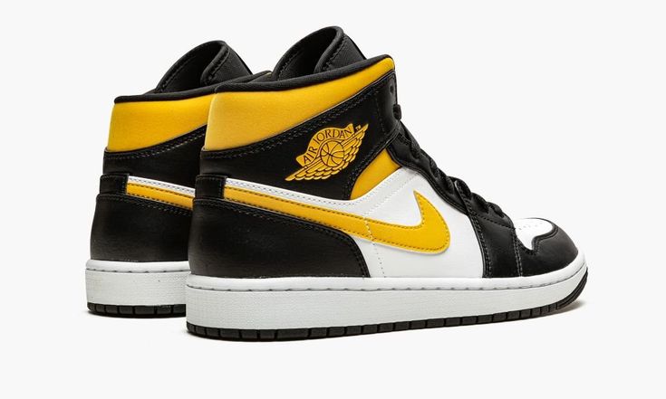 The Air Jordan 1 Mid “White/Pollen/Black” is a clean look for the mid-top version of the retro basketball shoe.  In “White/Pollen/Black,” the Jordan 1 Mid arrived in 2021 in yet another wearable colorway.  The perforated toe and mid-panel display a white leather construction.  Contrasting black leather can be found on the various overlays on the upper, including on the Swoosh logo.  A University Gold “Wings” logo appears on the black leather overlay on the yellow leather collar.  Additional Univ Air Jordan 1 Mid White, Jordan 1 Mid White, Retro Basketball Shoes, Retro Basketball, Nike Air Jordan 1 Mid, Nike Dunk High, Nike Shox, Air Jordan 3, Nike Air Max Plus