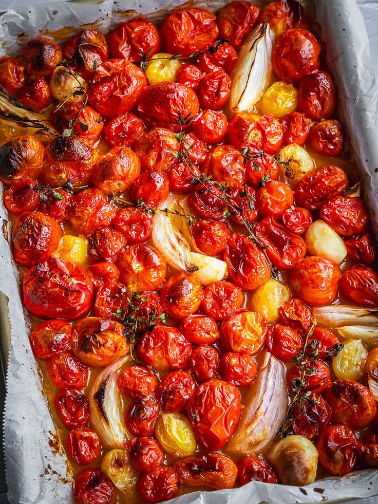 roasted tomatoes and onions in a baking dish