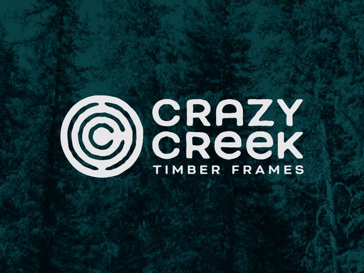 the crazy creek timber frames logo on a dark green background with trees in the background