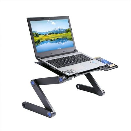 a laptop computer sitting on top of a desk with a keyboard attached to the stand