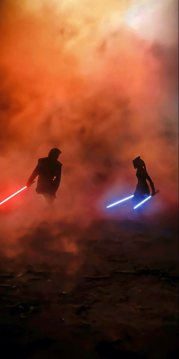 two people in silhouette with lightsabed on their backs, one holding a light saber