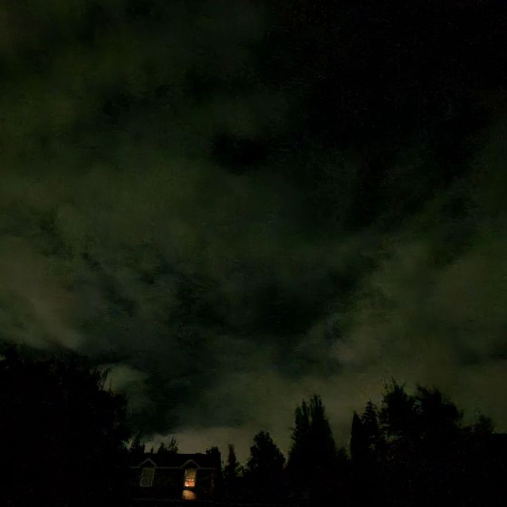 the sky is dark and cloudy at night