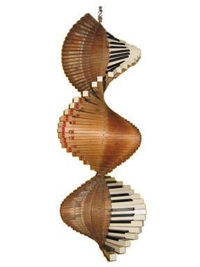 two spirals made out of wood and white piano keys