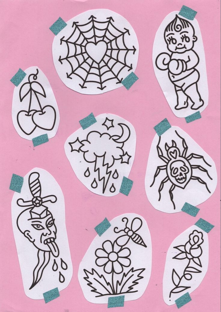 some stickers on a pink paper with black and white designs