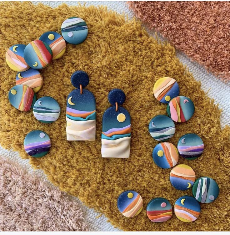 some colorful buttons are laying on a rug