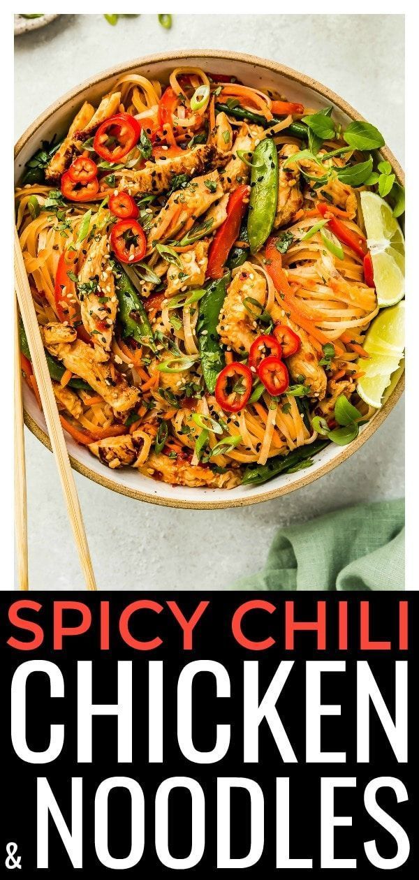 spicy chili chicken noodles and vegetables in a bowl with chopsticks