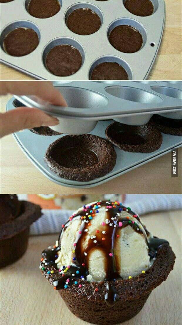 chocolate cupcakes with ice cream and sprinkles in them on a tray