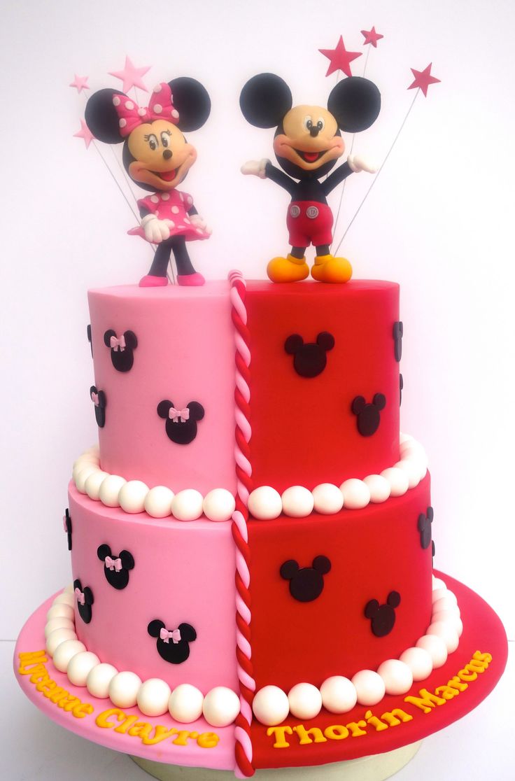 two mickey and minnie mouse cakes on top of each other, with the same theme