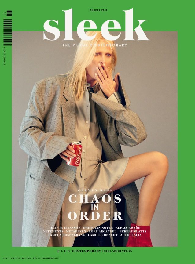 the cover of sleek magazine features a woman in a suit and red boots, holding a can