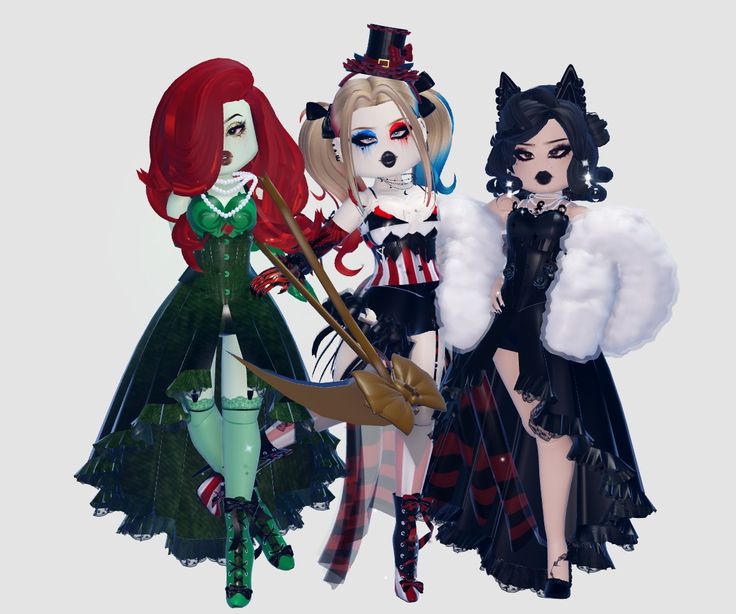 three dolls are dressed up as witches and cats for the halloween costume contest, one is holding a broom