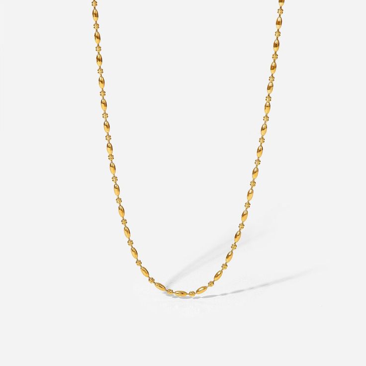 The Gold Beads Necklace, with its series of delicate 18k gold-plated beads, offers understated elegance. Its simple yet sophisticated design is perfect for both everyday wear and special occasions, complementing any outfit. Dainty Yellow Gold Beaded Chain Necklace, Simple Everyday Yellow Gold Chain Necklace, Minimalist Beaded Chain Gold Plated Necklace, Minimalist Gold-plated Beaded Chain Necklace, Chic Gold Necklaces With Round Beads, Elegant Beaded Necklaces With Adjustable Chain For Layering, Chic Gold Necklace With Round Beads, Elegant Gold Chain Necklace With Beads, Classic Everyday Chain Necklace With Round Beads