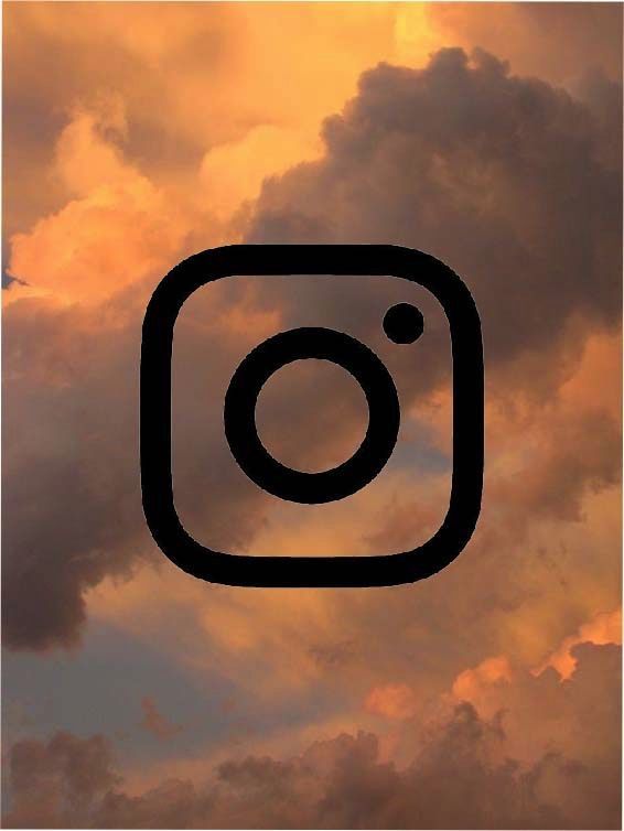 the instagram logo is shown in front of a cloudy sky with orange and yellow clouds