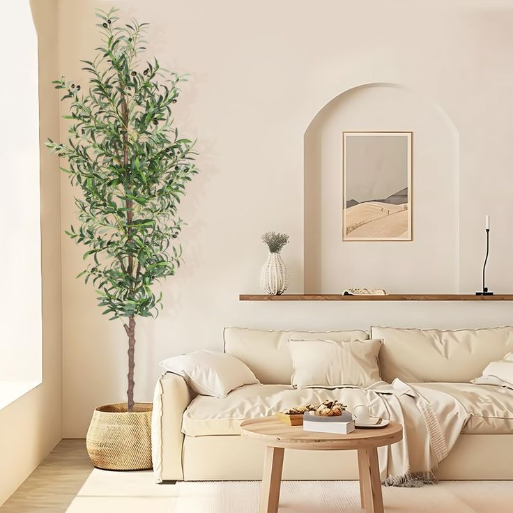 a living room filled with furniture and a potted plant