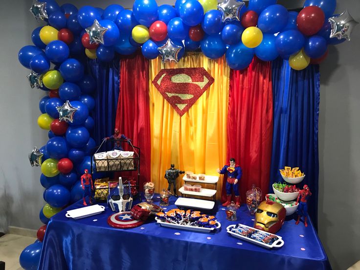 a superman themed birthday party with balloons and decorations