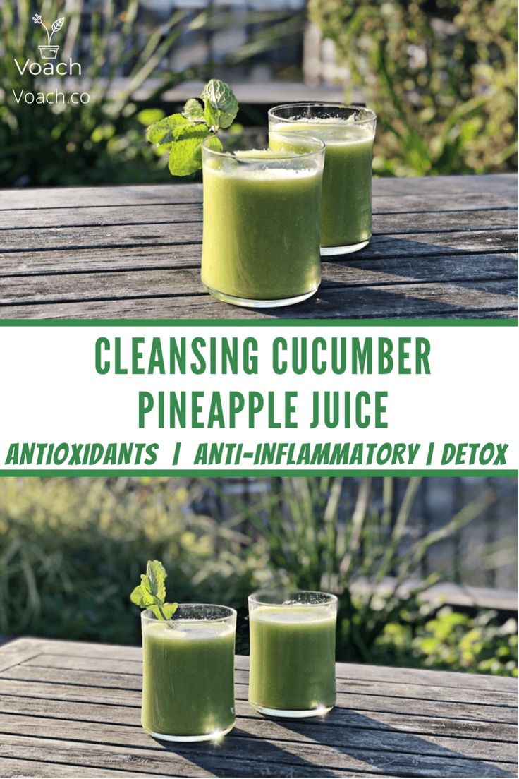 three glasses filled with green juice sitting on top of a wooden table next to each other