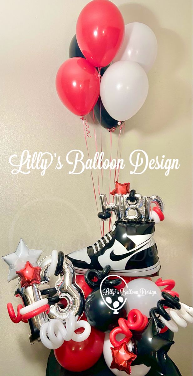 a bunch of balloons that are in the shape of shoes and skates on top of a table