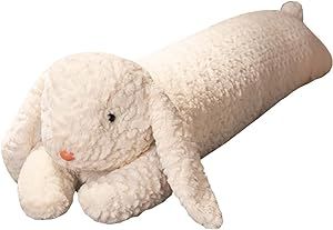 a white stuffed animal laying on its side