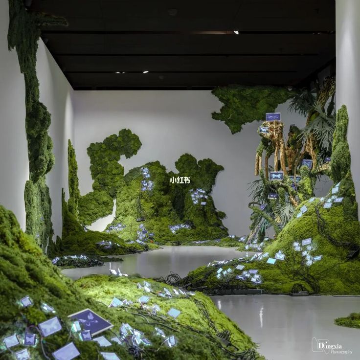 an art installation with moss growing on the walls