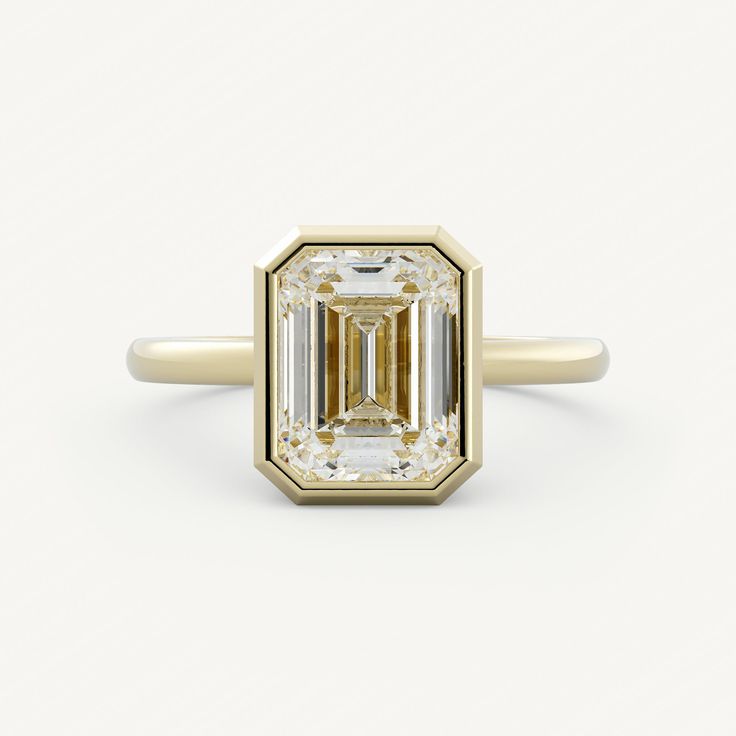 Elliot - Olive Ave Jewelry Refined Emerald Cut Moissanite Jewelry, Elegant Asscher Cut Emerald Ring In 14k Gold, Modern Emerald Jewelry With Center Stone, Refined Diamond Cut Emerald Jewelry, Classic Emerald Cut Ring With Center Stone, Classic Emerald Cut Emerald Ring, Classic Emerald-cut Single Diamond Jewelry, Timeless Diamond Ring With Baguette Cut And Bezel Setting, Timeless Baguette Cut Diamond Ring With Bezel Setting