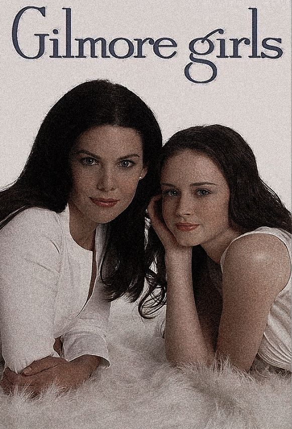 two young women laying on top of a white fur covered floor next to each other