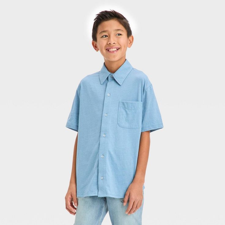 Add cool appeal to your kid's dressed-up looks with the Short-Sleeve Washed Button-Down Shirt from art class™. This solid short-sleeve shirt features a collared neckline and chest patch pocket to complete the classic look, while the front buttons add to the functional style. The single layered construction lends cool and comfy all-day wear, and the below-hip length allows for easy layering with a range of bottoms. art class™: One-of-a-kind looks for the one and only you. Blue Short Sleeve School Shirt, Blue Relaxed Fit Tops For School, Solid Color Cotton School Shirt, Solid Cotton School Shirt, Solid Cotton Shirt For School, Solid Summer Shirt For School, Casual Blue Shirt For School, Blue School Shirt For Summer, Blue Shirt For School In Summer