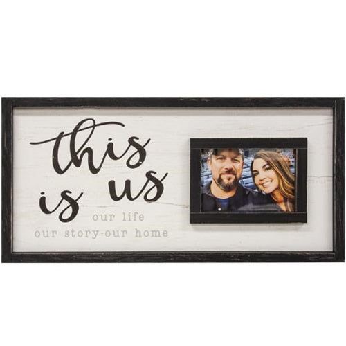 a white and black frame with the words this is us on it